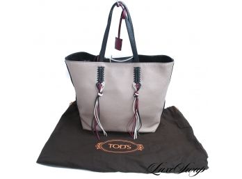 A RECENT, LIKE NEW, AND VERY EXPENSIVE TODS MADE IN ITALY TAN TOTE BAG WITH TRICOLOR TASSELS