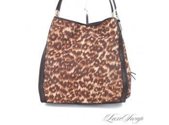 NEAR MINT AND PROBABLY NEVER USED ULTRA RECENT COACH LARGE LEOPARD PRINT MULTI POCKET BAG 01481-32410