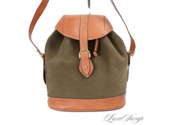 A QUALITY ANONYMOUS OLIVE GREEN NUBUCK AND SADDLE TAN LEATHER MEDALLION LINED MID SIZE BACKPACK BAG