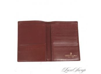NEAR MINT AND INCREDIBLE VINTAGE GUCCI MADE IN ITALY BORDEAUX LEATHER EMBOSSED CREST MENS COAT WALLET
