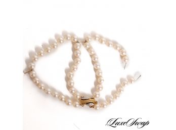 ONE DOUBLE STRAND OF PEARLS BRACELET WITH A 585 HALLMARKED GOLD TONE AND POSSIBLE DIAMOND INLAY CLASP