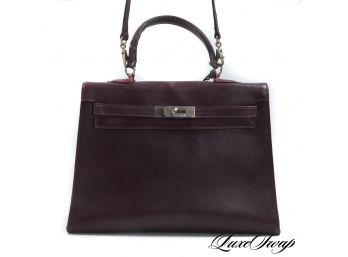 A BURGUNDY GRAINED CALF LEATHER KELLY STYLE BAG WITH SHOULDER STRAP