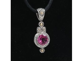 A MAGNIFICENT HALLMARKED 18K &LIKELY STERLING SILVER PENDANT NECKLACE WITH PINK STONE ON BLACK SILK CORD .41