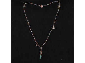 A BEAUTIFUL MULTICOLOR BEADED AMULET CHARM NECKLACE WITH HAMZA, TURQUOISE HORN, FEATHERS AND TASSELS