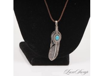 ONE BEAUTIFUL AND LIKE NEW .925 STERLING SILVER PENDANT IN SOUTHWESTERN FEATHER SHAPE WITH TURQUOISE CABOCHON