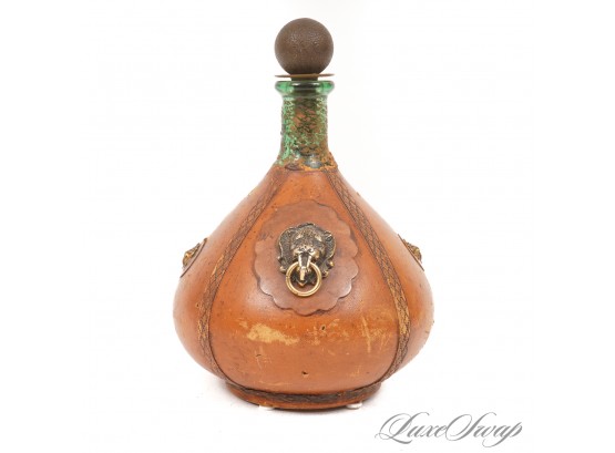 ONE VINTAGE / ANTIQUE MADE IN ITALY LEATHER WRAPPED 10' GLASS DECANTER WITH LIONS HEAD DOORKNOCKER ORNAMENTS