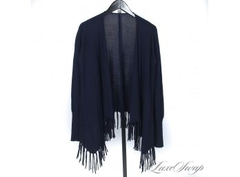 A DELICIOUSLY SOFT NAVY BLUE CASHMERE PONCHO WRAP WITH FRINGED HEMS