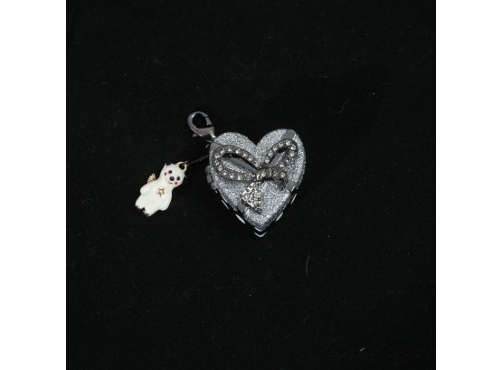 A VERY CHARMING SMALL LOCKET HEART SHAPED BOX (GO NIRVANA!) WITH CRYSTAL BOW AND SMALL TRINKETS INSIDE