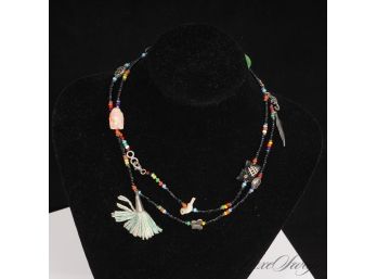 #18 A QUALITY LONG FULLY BEADED LONG NECKLACE WITH TASSEL POMS, BUTTERFLIES AND FEATHERS