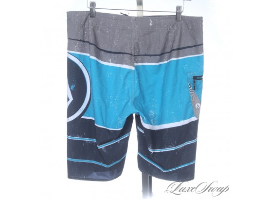 SURFS UP! VOLCOM MENS 4-WAY STRETCH PEACOCK BLUE COLORBLOCK STRIPE UNLINED BATHING SUIT