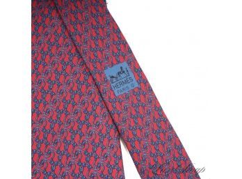MOST COVETED AND AUTHENTIC HERMES MADE IN FRANCE MENS SILK TIE IN RED WITH GEOMETRIC CHAINS 7881 MA