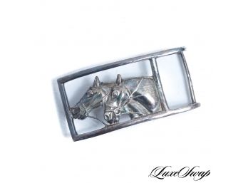 AN IMPRESSIVE CUSTOM MADE LARGE DOUBLE HORSEHEAD EQUESTRIAN BELT BUCKLE, LIKELY STERLING SILVER
