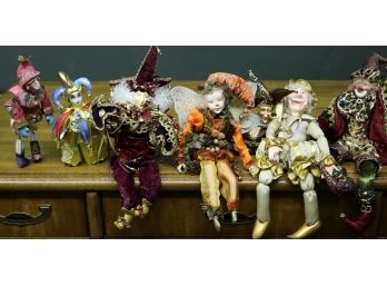 Seven Harlequin Dolls
