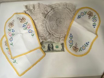 Two Crocheted Doilies And 3 Mint Cond. Embroidered Pieces.