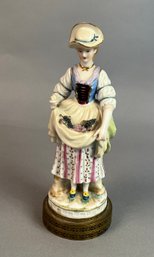 Porcelain Figurine Of A Woman Collecting Grapes