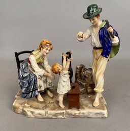 Porcelain Figurine Of A Man, Woman And Child
