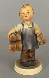 Goebel Hummel Figurine Of A Child Holding Shoes