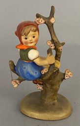 Goebel Hummel Figurine Of A Girl Sitting In A Tree With Cherry Blossoms