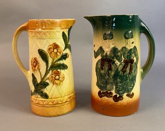 Two Yellow Glazed Decorated Pitchers