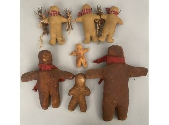 Seven Handcrafted Gingerbread Men Including Cloth And Oil Cloth