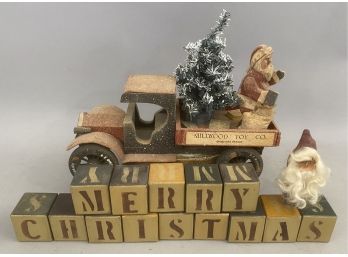 Christmas Blocks With Toy Truck Holding Santa And Christmas Tree.