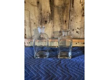Large And Smaller Glass Bottles. JH