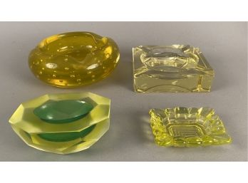 Four Small Vaseline Glass Vessels