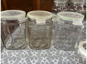 Three Glass Canisters With Plastic Tops-kt21