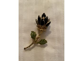 55. Lovely Black Flower Pin In Goldtone