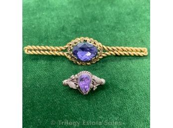 Two Brooches With Purple Stones