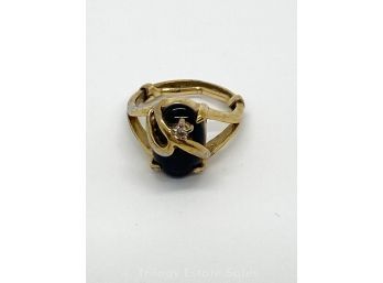 Ring With Black Stone Wrapped By Setting