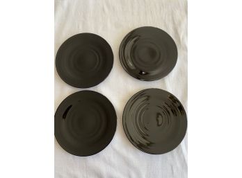 Four Black Glass Plates