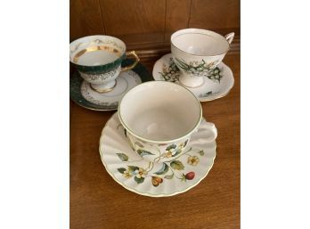 Three Tea Cups And Saucers