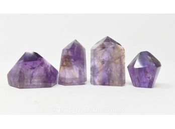 Four Pieces Of Polished Purple Crystals