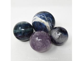 Four Polished Stone Spheres