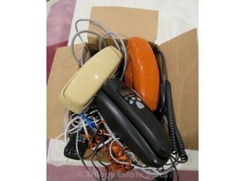 Old Phones With Various Cords And Accessories