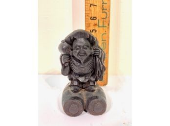 Carved Wood Sculpture Of Buddha Carrying Sack On His Back