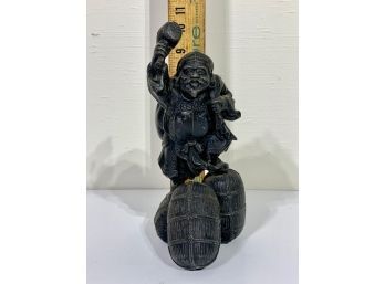 Antique Statue Of Man With Mallet Carrying Sack