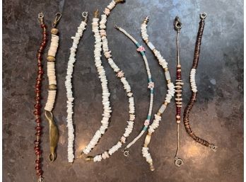 9 Silver, Shells And Beaded Bracelets