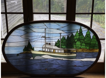FRAMED OVAL STAINED GLASS WINDOW OF A BOAT