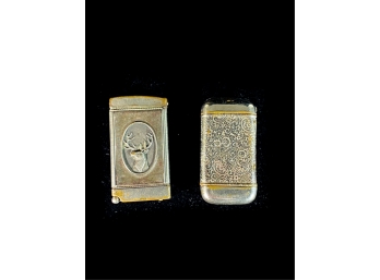 (2) VINTAGE MATCH SAFES, (1) WITH BUCK