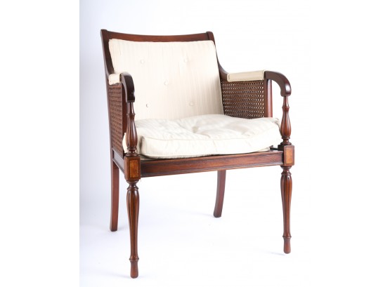 UPHOLSTERED MAHOGANY CANED ARMCHAIR