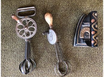 (2) ANTIQUE EGG BEATERS AND AN IRON