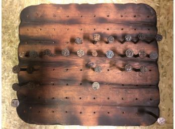 (26) NUMBERED RAILROAD NAILS DISPLAYED ON BOARD