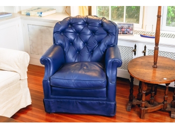 LOW LEATHER UPHOLSTERED ARMCHAIR with TUFTED BACK