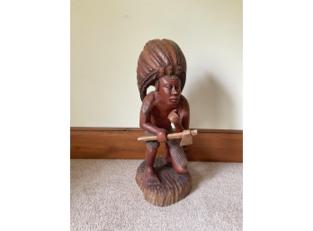 HAND CARVED WOODEN INDIAN HOLDING A TOMAHAWK