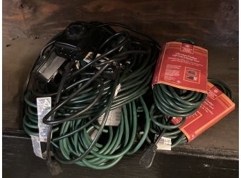 GROUP OF GREEN EXTENSION CORDS AND TIMERS