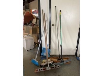 VARIOUS BROOMS AND DUST PANS