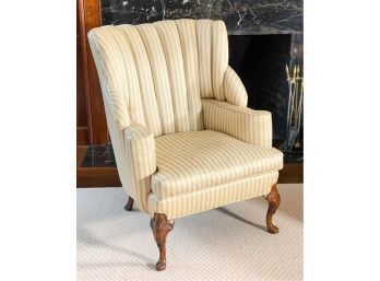UPHOLSTERED WINGBACK ON CARVED CABRIOLE LEGS