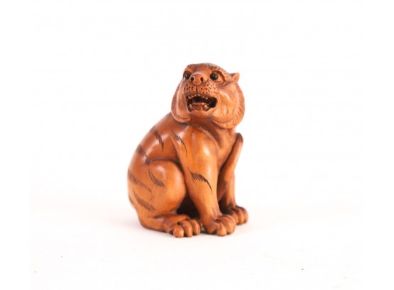 FINE OJIME CARVING OF A YOUNG TIGER